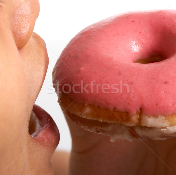 Stock photo: Eating An Unhealthy Donut