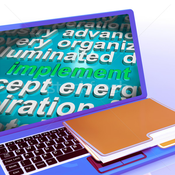 Implement Word Cloud Laptop Shows Implementing Or Execute A Plan Stock photo © stuartmiles