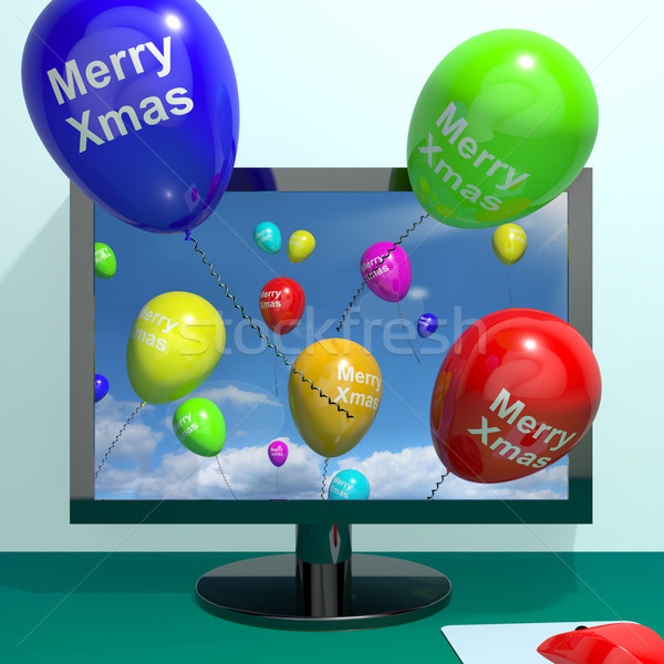 Colorful Balloons With Merry Xmas From Computer Screen For Onlin Stock photo © stuartmiles