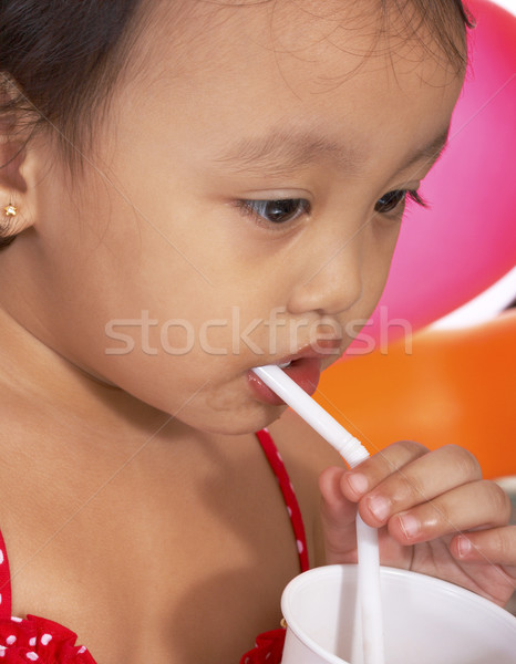 Sipping A Drink At A Birthday Party Stock photo © stuartmiles