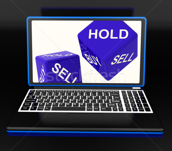 Sell And Hold Dices On Laptop Showing Strategies Stock photo © stuartmiles