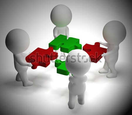 Jigsaw Pieces Being Joined Showing Teamwork And Collaboration Stock photo © stuartmiles