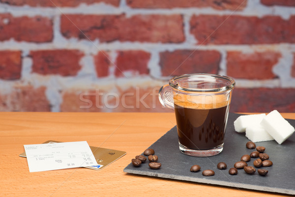 Cup of coffee with bill Stock photo © Studio_3321