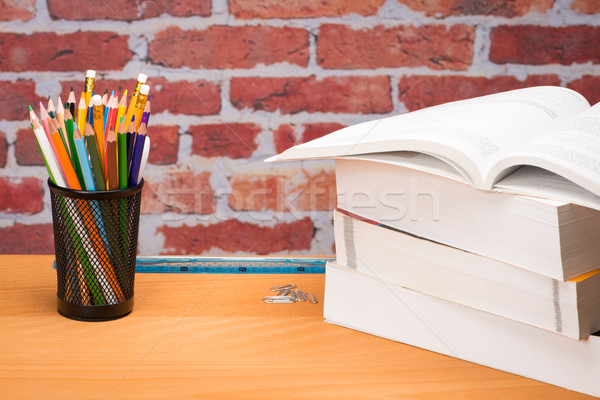 Fournitures scolaires mur de briques livre livres école crayon [[stock_photo]] © Studio_3321