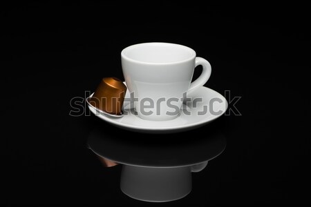 Cup of coffee with capsules Stock photo © Studio_3321