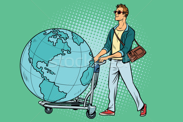 man tourist with a Luggage cart with the planet Earth Stock photo © studiostoks