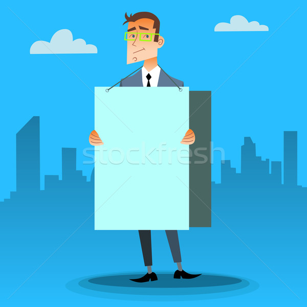 Businessman with a poster and place for text Stock photo © studiostoks