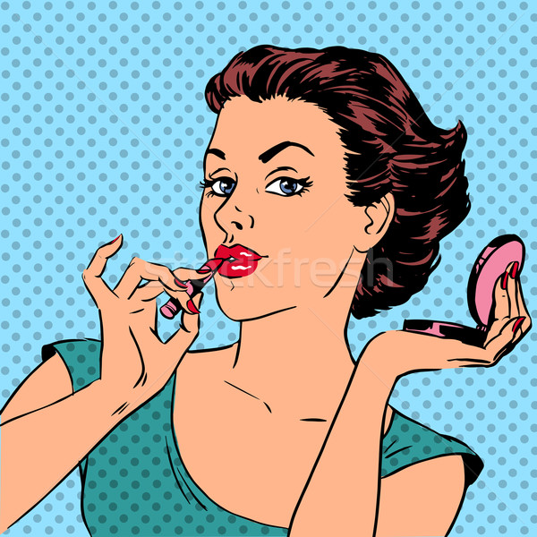 Girl paints lips with lipstick cosmetics beauty perfumes pop art Stock photo © studiostoks