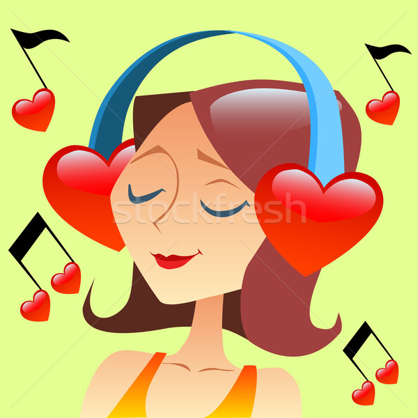 Girl listening to music with headphones in the form of a red hea Stock photo © studiostoks