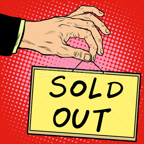 Hand holding a sign sold out Stock photo © studiostoks