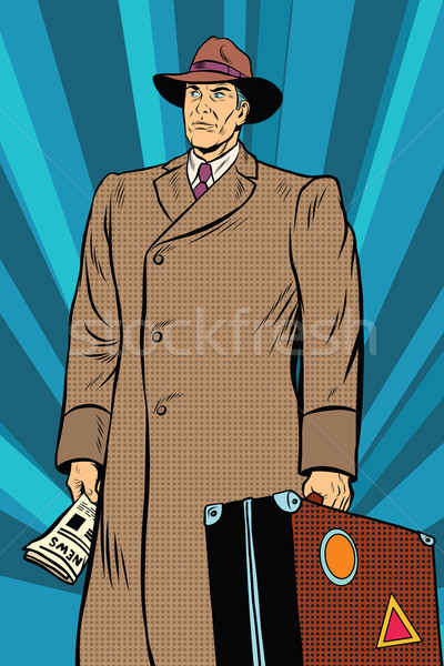 Retro man in cloak with suitcase Stock photo © studiostoks