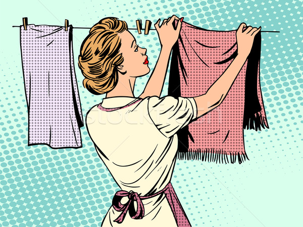 woman hangs clothes after washing housewife housework comfort Stock photo © studiostoks