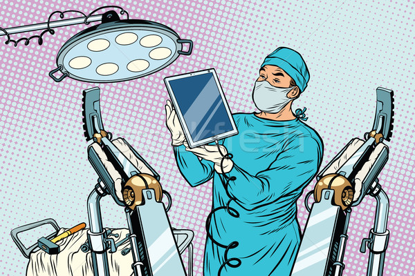 Obstetrician delivered a baby robot computer tablet Stock photo © studiostoks
