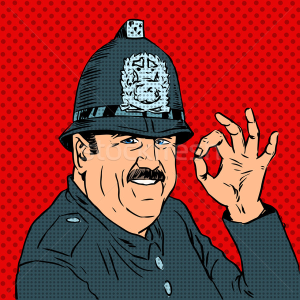 English policeman in uniform and helmet shows gesture OK Stock photo © studiostoks