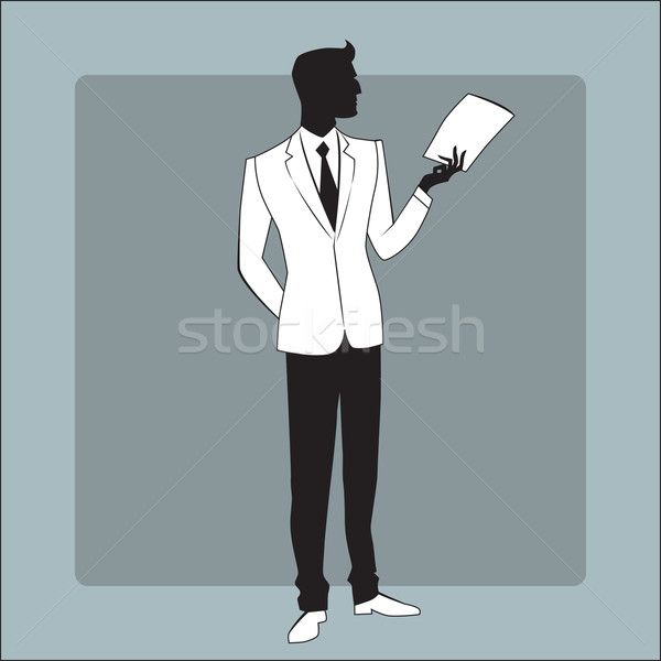 Businessman in modern clothes reads the report Stock photo © studiostoks