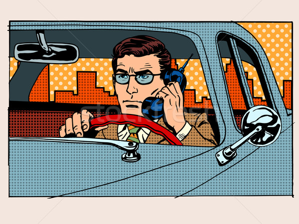 Retro driver talking on cell phone Stock photo © studiostoks