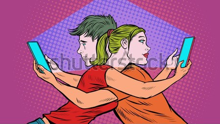 Retro man and woman kissing through a smartphone Stock photo © studiostoks