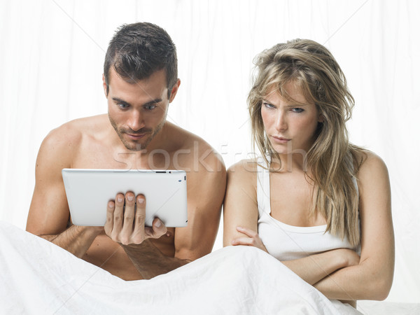 uncommunicative couple on bed in white  Stock photo © Studiotrebuchet