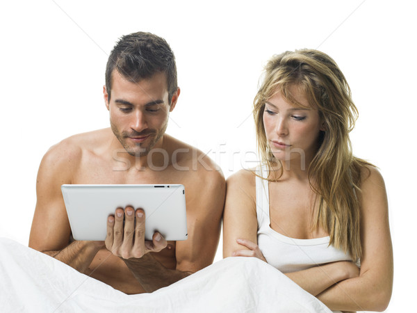 uncommunicative couple on bed in white  Stock photo © Studiotrebuchet