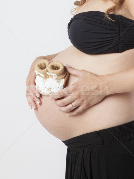 Zwangere vrouw holding handen mooie buik jonge Stockfoto © Studiotrebuchet