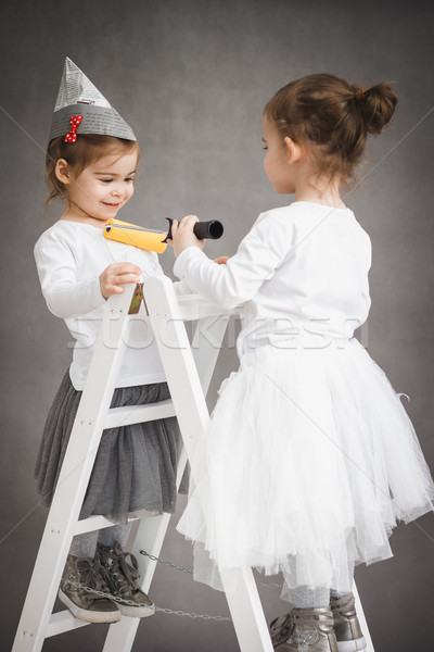 Dziewcząt stałego drabiny farby dwa studio Zdjęcia stock © superelaks