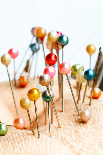 Fabric pincushion with pins on white background Stock photo © supersaiyan3