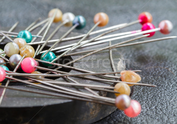 Pins attach round magnetic pincushion on black leather Stock photo © supersaiyan3