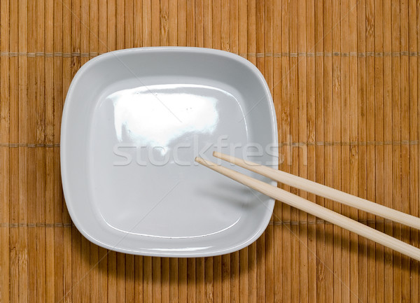 Placa palillos bambú restaurante mesa cena Foto stock © Supertrooper