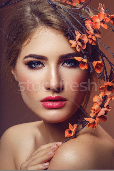 Beautiful girl with sakura branch Stock photo © svetography