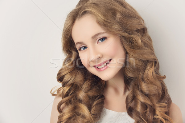 Lány hosszú göndör haj gyönyörű tinilány fehér Stock fotó © svetography