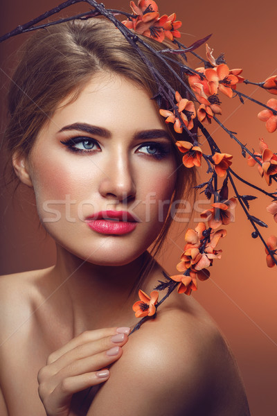 Beautiful girl with sakura branch Stock photo © svetography