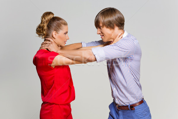Couple strangling each other Stock photo © svetography