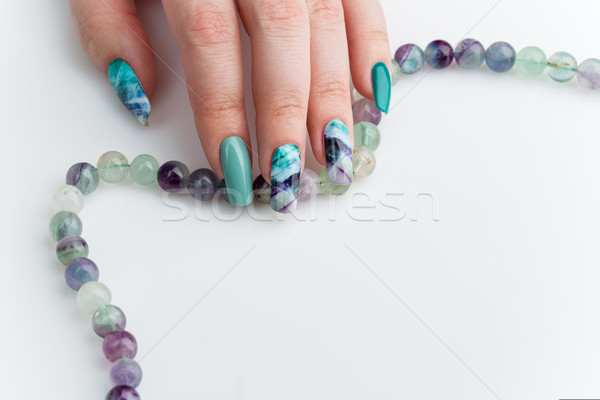 Closeup of woman hand with colorful nails Stock photo © svetography