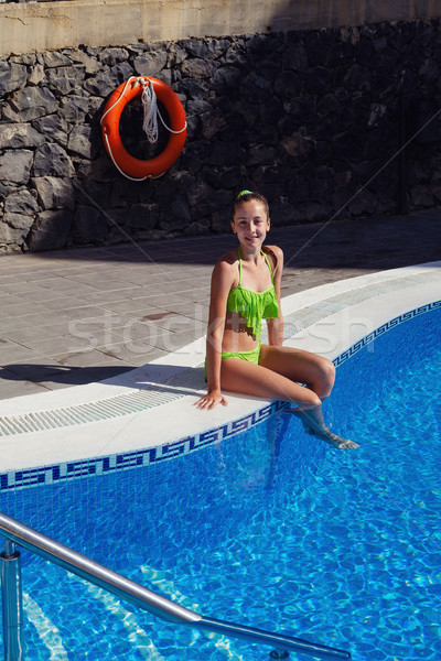 teen girl relaxing near swimming pool Stock photo © svetography