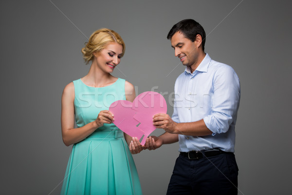 Gyönyörű pár tart rózsaszín összetört szív fiatal pér Stock fotó © svetography