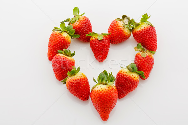 Closeup of fresh strawberries in heart shape Stock photo © svetography