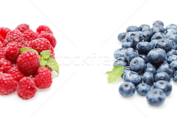 Stock photo: blueberry and raspberry berries isolated on white background