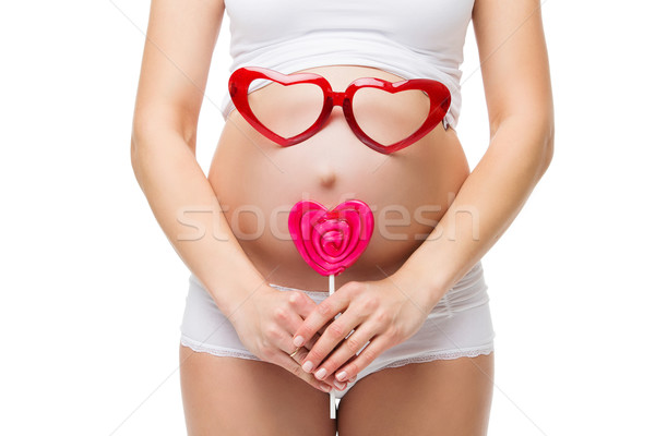 Sunglasses for the unborn baby in the belly of pregnant woman Stock photo © svetography