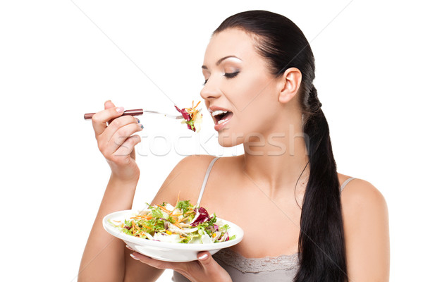 Healthy lifestyle - young woman eating salad Stock photo © svetography
