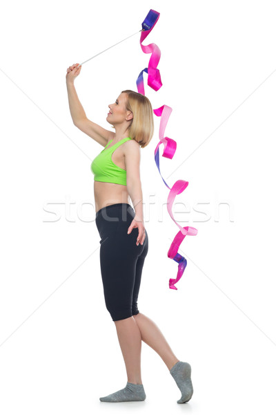Beautiful woman doing sport exercise with gymnastic ribbon Stock photo © svetography