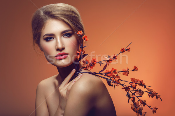 Beautiful girl with sakura branch Stock photo © svetography