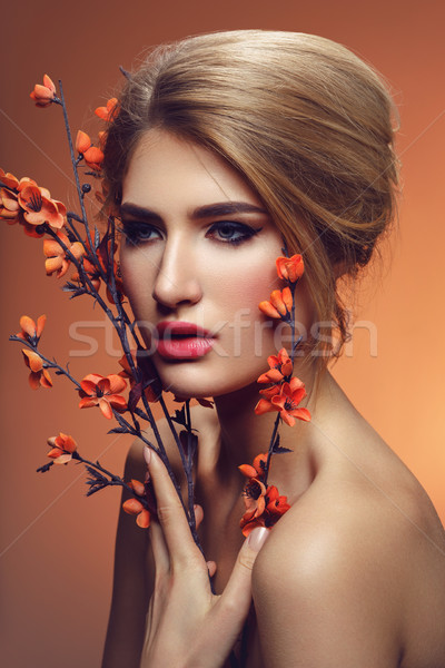 Beautiful girl with sakura branch Stock photo © svetography