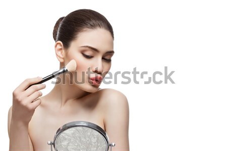 Girl applying blush Stock photo © svetography