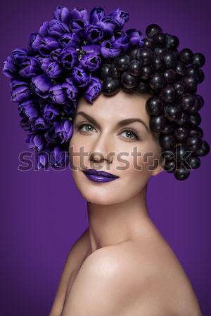 Girl with blueberries and flowers Stock photo © svetography