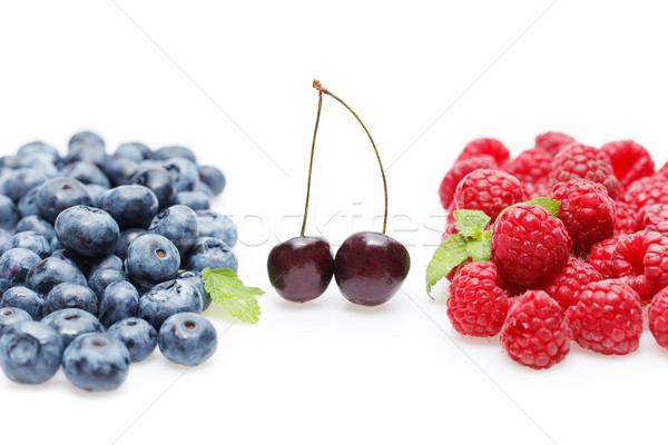 Stock photo: blueberry, cherry and raspberry berries isolated on white background
