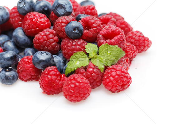 Stock photo: blueberry and raspberry berries isolated on white background