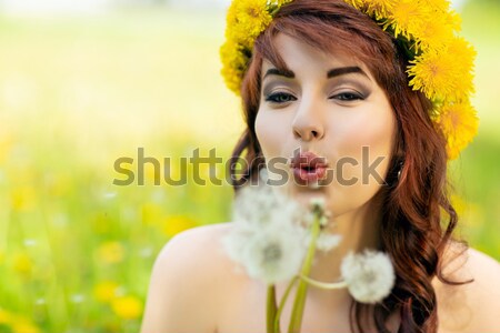 Girl in rapeseed field Stock photo © svetography
