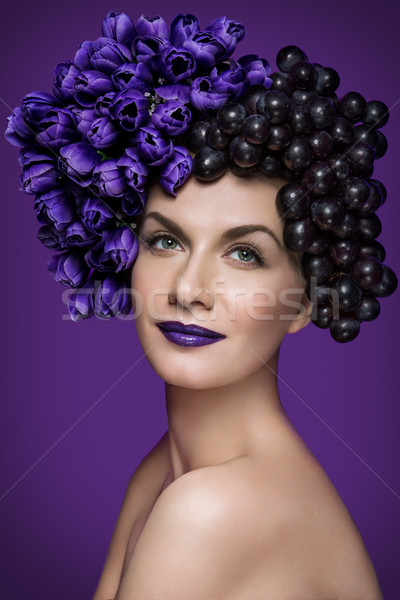 Girl with flowers and grapes Stock photo © svetography
