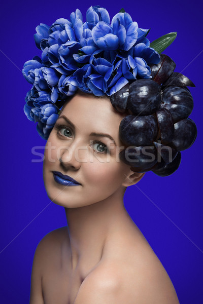 Girl with plums and flowers Stock photo © svetography