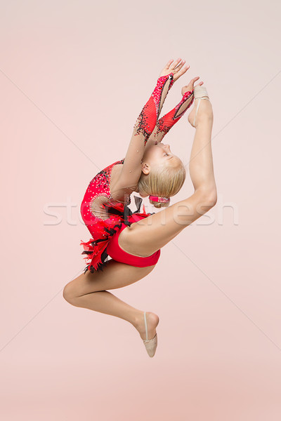 Genç kız jimnastikçi atlama ışık pembe kız Stok fotoğraf © svetography